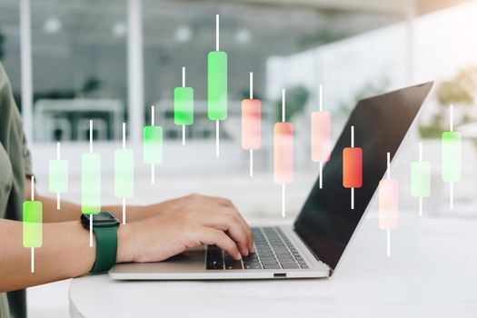 A fintech financial icon and market stock graph appear on the computer screen monitor. Concept of financial business technology freedom dream life.