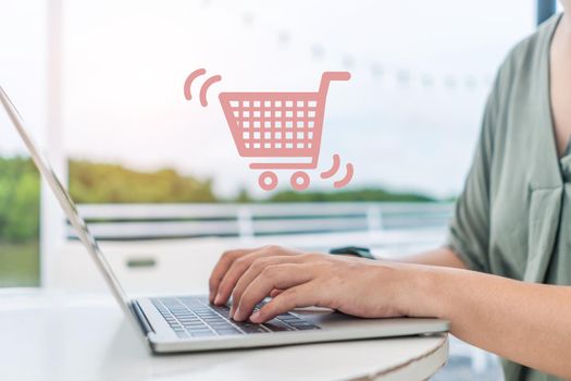 Women do online selling for customers buying online with chat boxes, carts, and dollar icons popping up on their laptops. Concept for social media marketing.