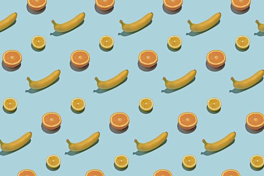 Summer fresh fruit food concept pattern. Tropical fruits on a blue background.