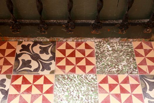 Colorful and vintage tile background on floor of abandoned house in Spain