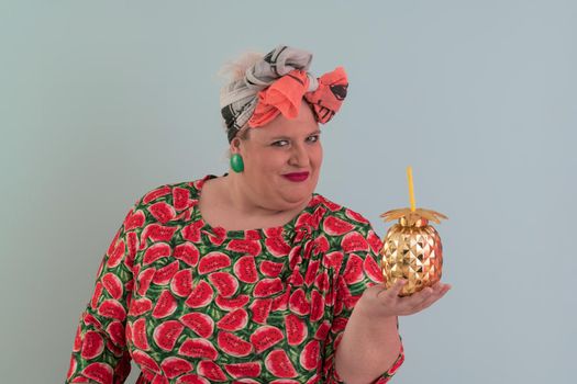 Overweight plus size female, fat women, Fat girl, Chubby, holding golden fruit ananas isolated on cyan background - lifestyle Woman diet weight loss overweight problem concept. High quality photo