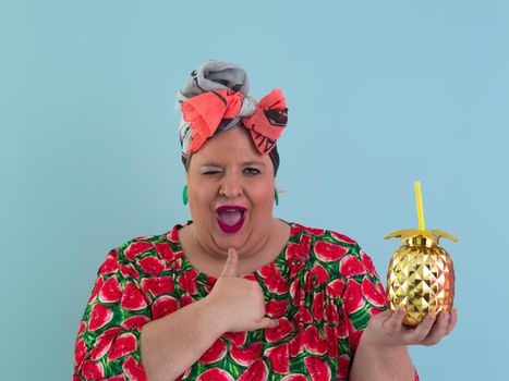 Overweight plus size female, fat women, Fat girl, Chubby, holding golden fruit ananas isolated on cyan background - lifestyle Woman diet weight loss overweight problem concept. High quality photo