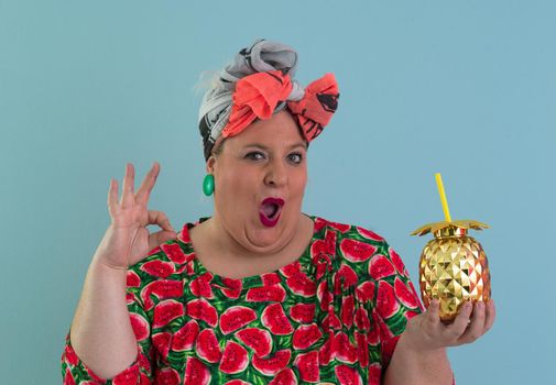 Overweight plus size female, fat women, Fat girl, Chubby, holding golden fruit ananas isolated on cyan background - lifestyle Woman diet weight loss overweight problem concept. High quality photo