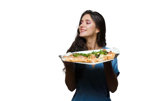 Girl courier with pinsa romana and scrocchiarella gourmet italian cuisine on white background. Holding traditional dish. Food delivery from pizzeria. Pinsa with meat, arugula, olives, cheese