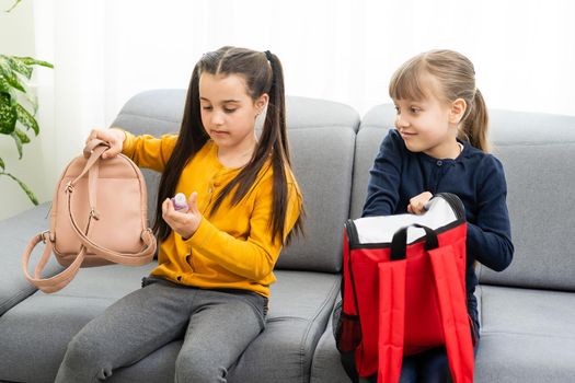 Children go back to school. Start of new school year after summer vacation. girls with backpack and books on first school day. Beginning of class. Education for kindergarten and preschool kids