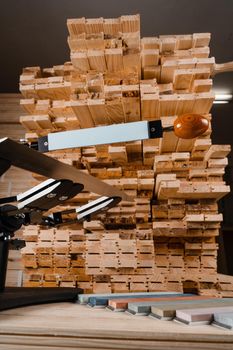 Sharpening knife process using professional sharpener with whetstone in workshop