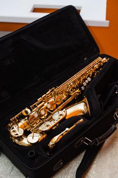 Saxophone musician instrument in case. Sax musical instrument for play jazz