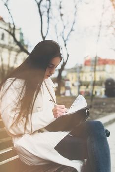 SME Businesswoman's hand with pen completing personal information on form. Young woman fills the release model