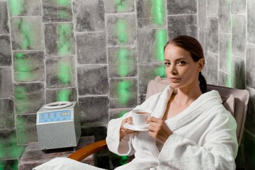 Woman in salt room relax. Inhalation therapy in salt room in spa