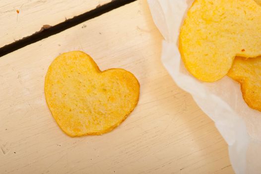 fresh baked heart shaped shortbread valentine day cookies on a paper wrap