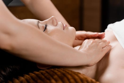 Neck and face massage in the spa. Beauty treatments for an attractive female model. Relaxation