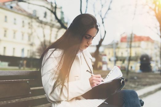 SME Businesswoman's hand with pen completing personal information on form. Young woman fills the release model