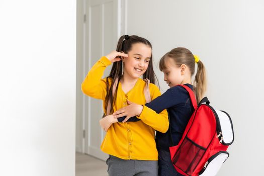 Kids going to school schoolgirls with backpacks, fancy girls concept.