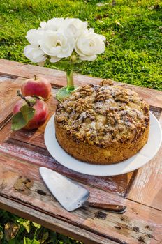 Autumn still life with cake, walnuts, apples and white roses. Rustic style. From series Natural organic food