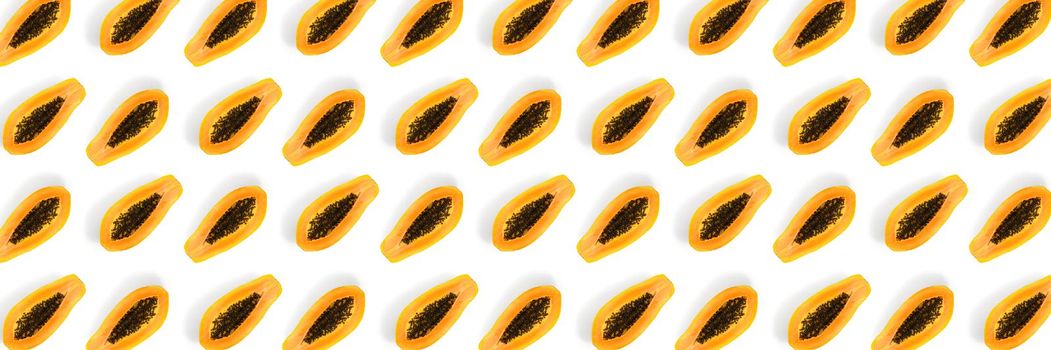 Fresh ripe papaya background on white backdrop. Modern tropical abstract background. Top view. Creative design, minimal flat lay concept. Trend tropical fruit food background - not seamless pattern