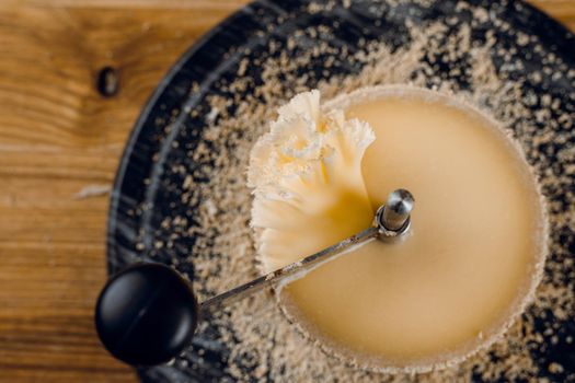 Shaving tete de moine cheese using girolle knife. Monks head. Variety of Swiss semi-hard cheese made from cows milk.