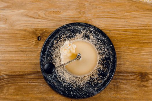 Shaving tete de moine cheese using girolle knife. Monks head. Variety of Swiss semi-hard cheese made from cows milk.