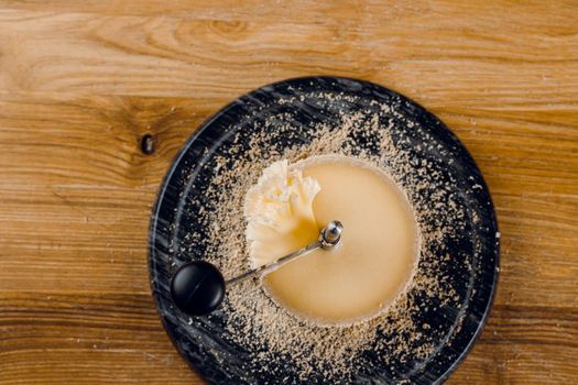 Shaving tete de moine cheese using girolle knife. Monks head. Variety of Swiss semi-hard cheese made from cows milk.