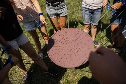 Teambuilding game for group of people for getting team spirit and increase friendship for colleagues. Labyrinth game for group of people.