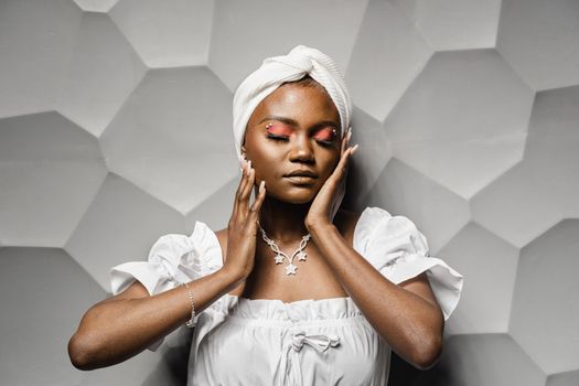 Beauty portrait of black attractive muslim model. Relaxing and meditation