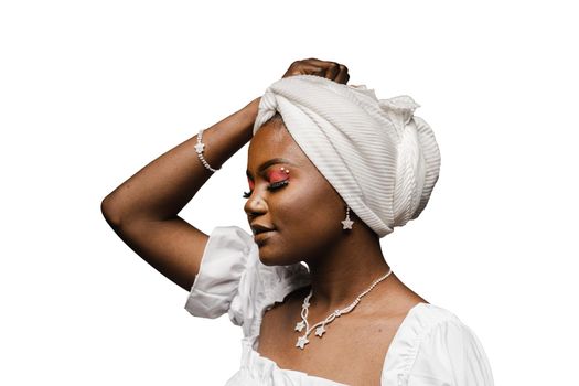 Beauty portrait of black muslim woman weared white dress and headscarf on white background. Softness and wellness of body and skin