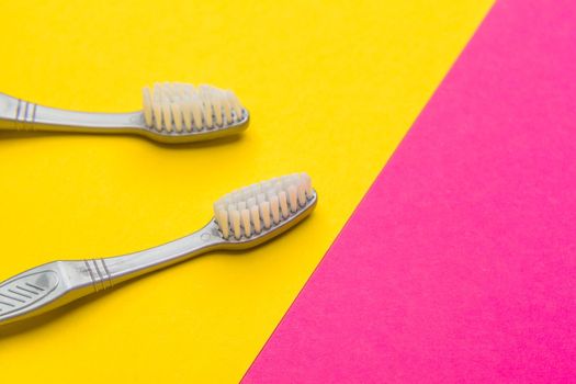 Flat lay composition with manual toothbrushes on color background, close up. creative photo