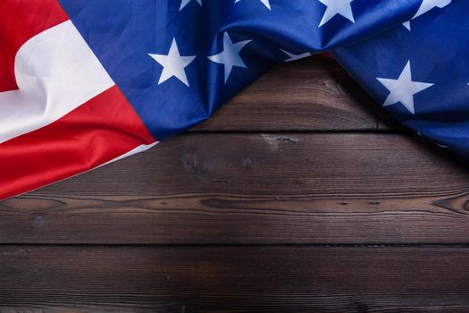 USA flag on dark wooden table background. creative photo.