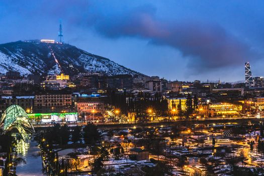 Evening view of Tbilisi's Old town with unusual heave snow