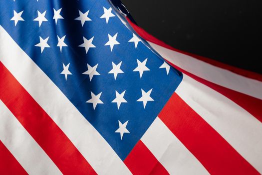 Beautifully waving star and striped American flag. creative photo.