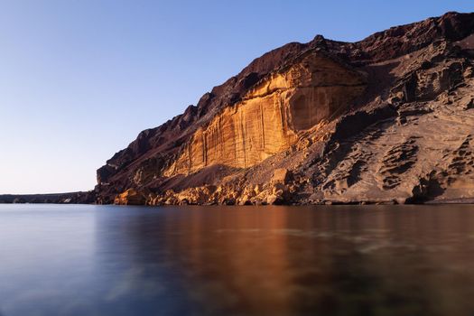 View of the Linosa volcano called Monte Nero in the beach of Cala Pozzolana di Ponente, Sicily