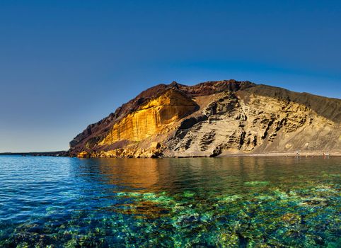 View of the Linosa volcano called Monte Nero in the beach of Cala Pozzolana di Ponente, Sicily