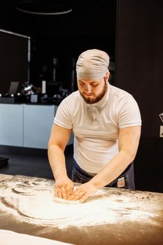 Making dough by hands at bakery or at home.