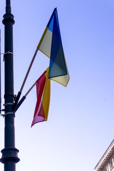 Ukrainian flag in Warsaw against the clear sky