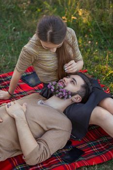 man with flowers in his beard