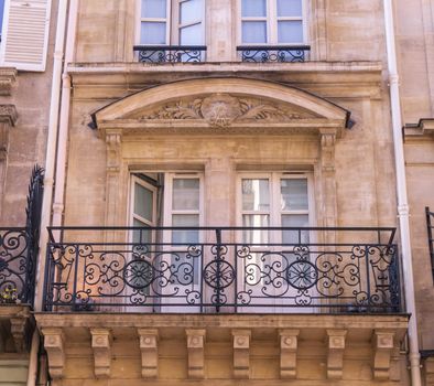 Parisian windows and balconies on a sunny day, France