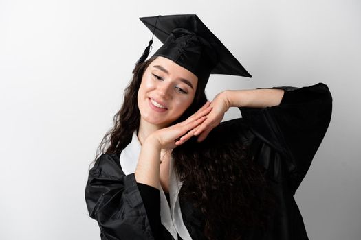 Distance learning online. Study at home. Graduation from college. Graduate in black robe smile on white background. Funny woman smiling after successful finish university and complete master degree