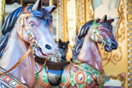 Florence, Italy - Circa March 2022: vintage carousel horse - antique attraction