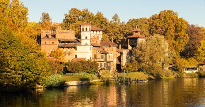 Turin, Italy - Circa November 2021: outdoors panorama with scenic Turin Valentino castle at sunrise in autumn