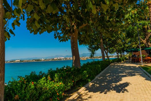 SIDE, TURKEY: The Promenade in the city of Side on a sunny summer day in the background of the blue sky.