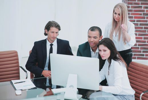 business people discussing financial information,sitting at his Desk.the concept of teamwork