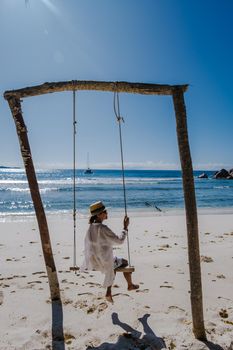 Anse Cocos beach, La Digue Island, Seyshelles, woman on vacation Seychelles. young Asian girl on the beach