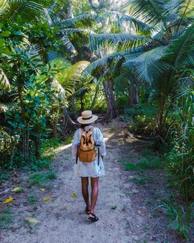 Anse Cocos beach, La Digue Island, Seyshelles, woman on vacation Seychelles. young Asian girl on the beach