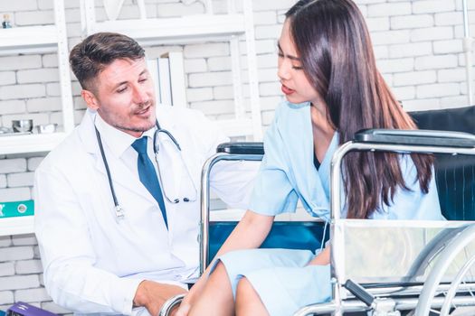 Doctor in professional uniform examining patient at hospital or medical clinic. Health care , medical and doctor staff service concept.