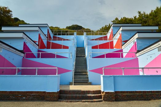 Colourful buildings with a high contrast blue and pink colour scheme.