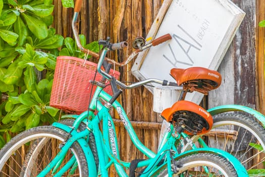 Tulum Mexico 02. February 2022 Turquoise bikes bicycles at the amazing and beautiful caribbean coast and beach panorama view with turquoise water people and huts of Tulum in Quintana Roo Mexico.