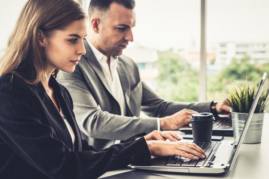 Businessman executive is in meeting discussion with a businesswoman worker in modern workplace office. People corporate business team concept.