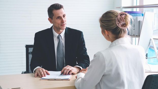 Job seeker in job interview meeting with manager and interviewer at corporate office. The young interviewee seeking for a professional career job opportunity . Human resources and recruitment concept.