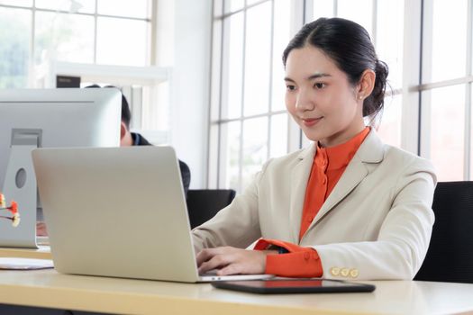 Business people working at table in modern office room while analyzing financial data report .