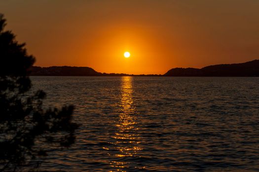 Sunset at the gialova lagoon. The gialova lagoon is one of the most important wetlands in Europe, as it constitutes the southernmost migratory station of migratory birds in the Balkans to and from Africa.