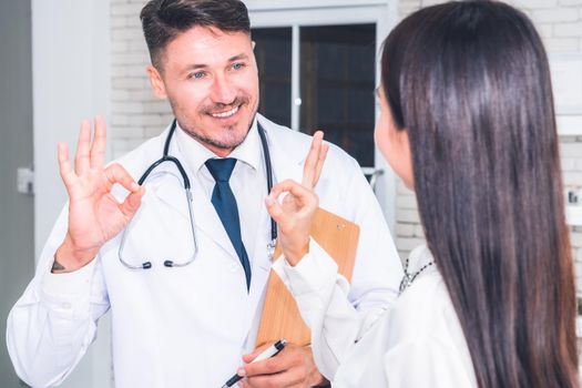 Doctor in professional uniform examining patient at hospital or medical clinic. Health care , medical and doctor staff service concept.